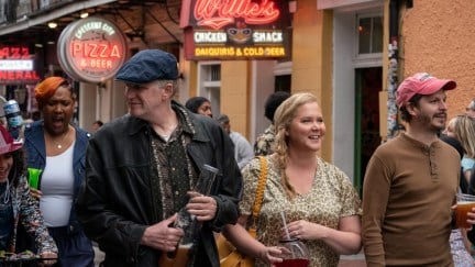 Michael Rapaport, Amy Schumer, and Michael Cera walk in the French Quarter in New Orleans in Hulu's 'Life and Beth'.