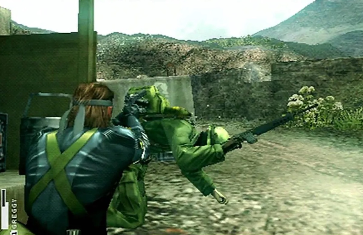 Snake levels a gun at an enemy soldier in "Peace Walker"