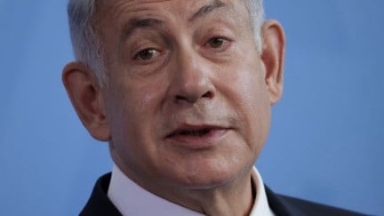 Benjamin Netanyahu against a blue background