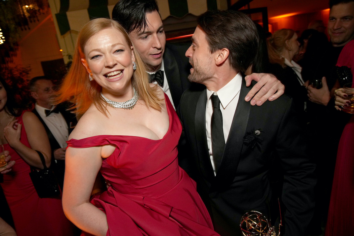Sarah Snook, Nicholas Braun, and Kieran Culkin talking excitedly at the Emmys