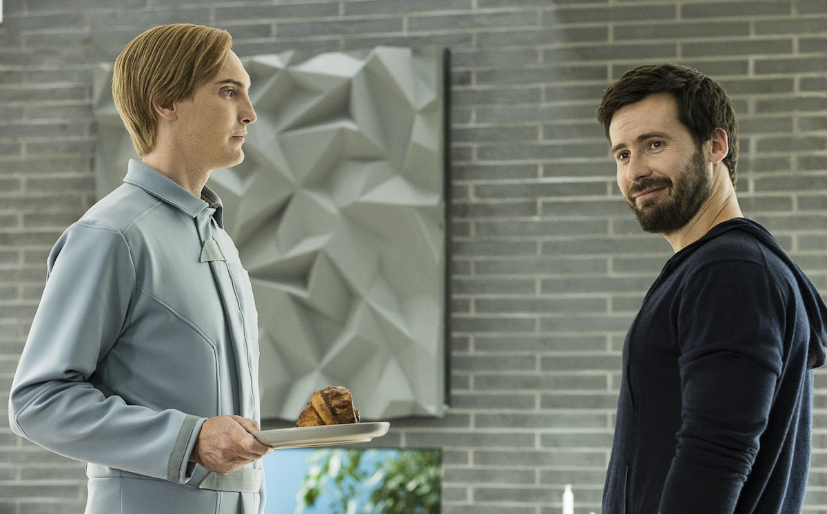 T.I.M. holds a plate of food out to Paul in T.I.M.