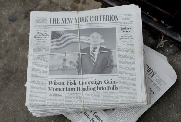 A bundle of newspapers with Wilson Fisk's photo on the front. A headline states that he's rising in the polls for his mayoral race.
