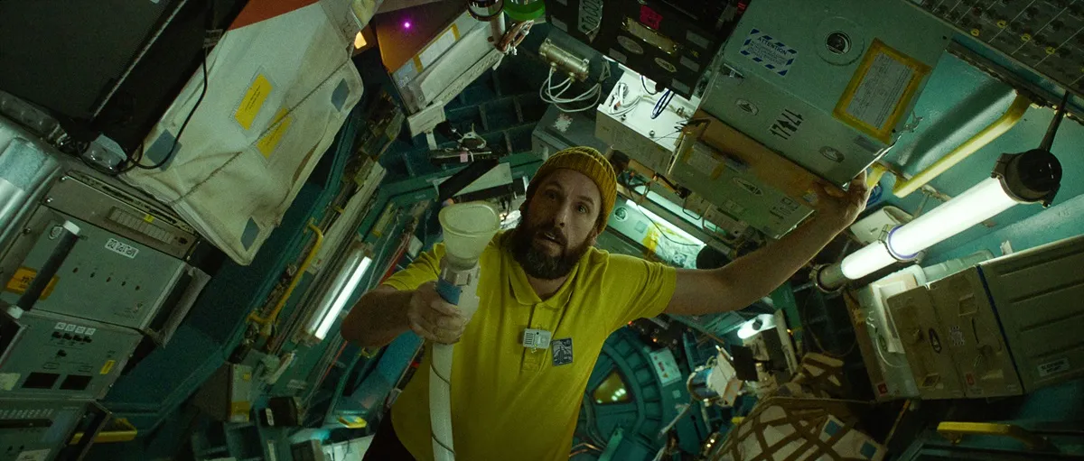 Adam Sandler as an astronaut in a space ship in Spaceman