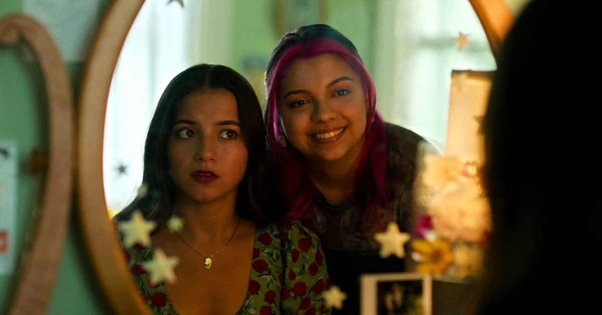Isabela Merced as Aza Holmes and Cree Cicchino as Daisy Ramirez looking in a mirror in Turtles All the Way Down