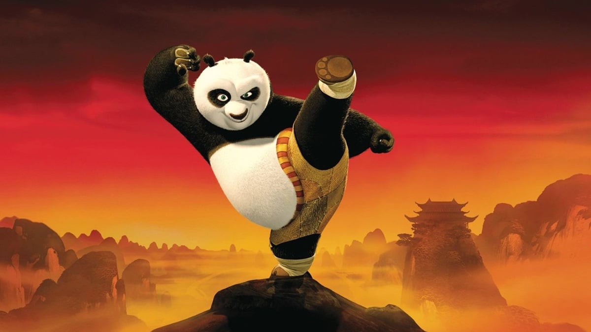 Kung Fu Panda doing a high kick with a red sunset behind him
