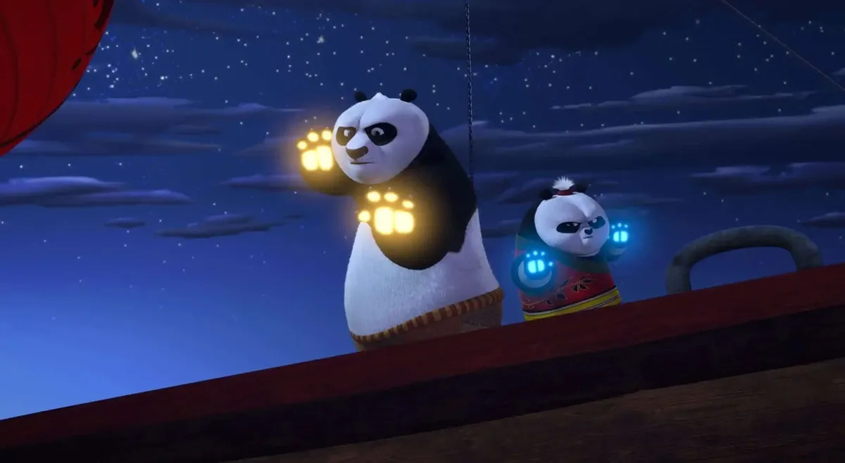 Po and son pictured with glowing paws in Kung Fu Panda The Paws of Destiny