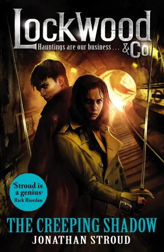 The book cover for Lockwood & Co. - The Creeping Shadow, featuring Anthony Lockwood and Lucy Carlyle in a train tunnel, holding rapiers