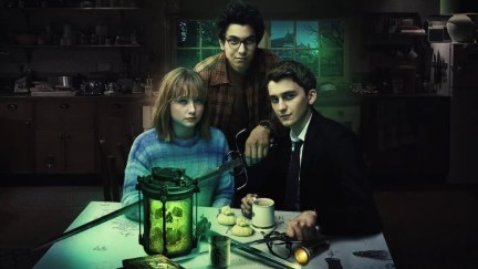 Key art for Netflix Original Series 'Lockwood & Co.' featuring the cast sitting at a table in the dark.