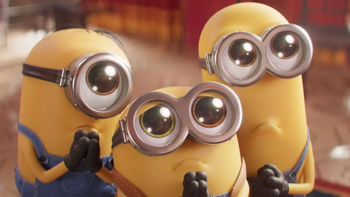 three Minions begging with huge eyes looking adorable
