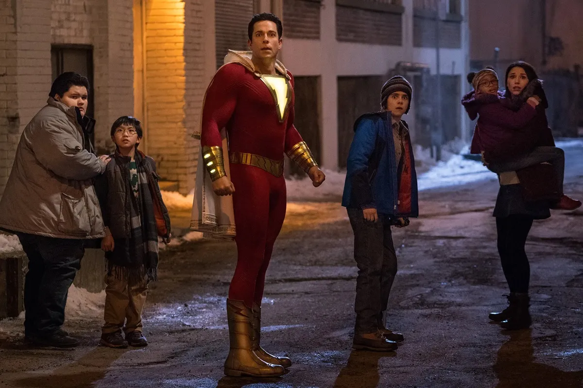 Shazam! stands with his brothers and sisters