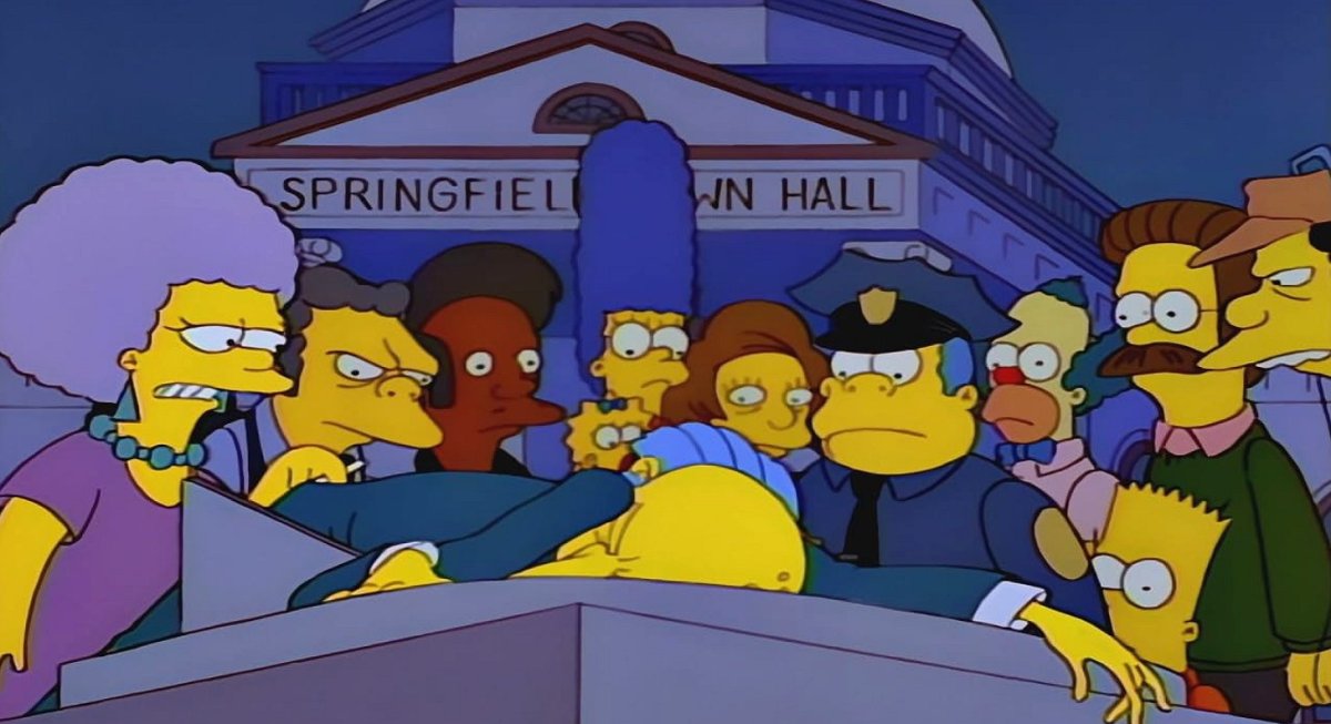 The residents of Springfield looking at a collapsed Mr Burns