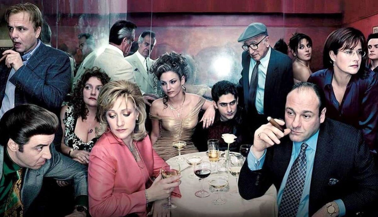 The cast of The Sopranos sitting at a table