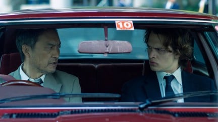 Ken Watanabe and Ansel Elgort in a car in Tokyo Vice