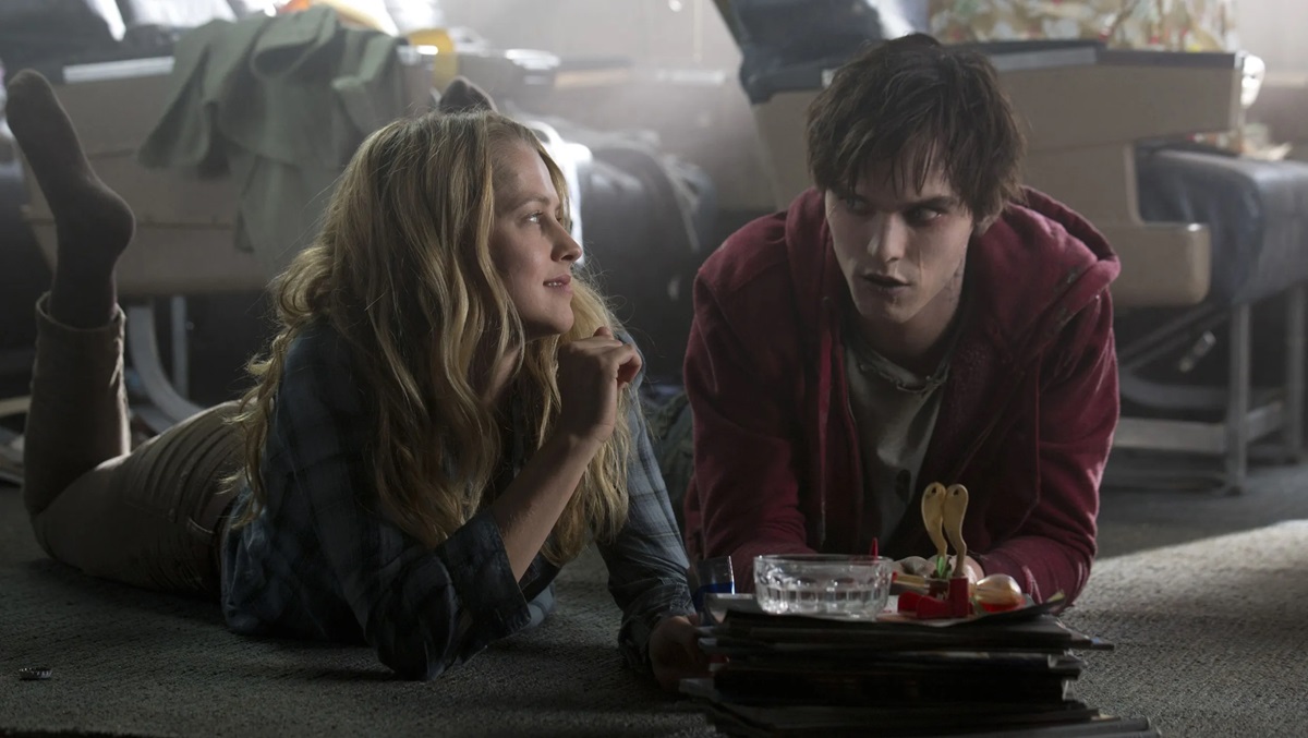 girl (Teresa Palmer) lying on her stomach gazing at boy (Nicholas Hoult) in Warm Bodies