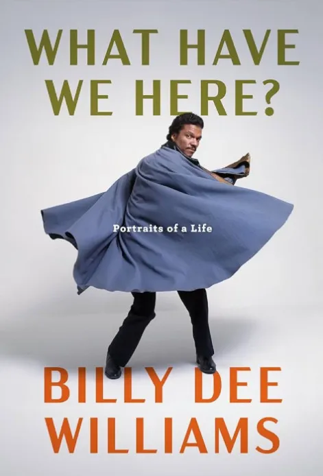 A Black man (Billy Dee Williams) stands and twirls in a blue cape on the cover of "What Have We Here?"