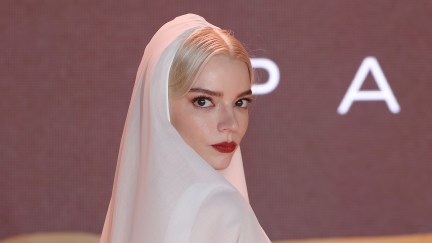 Anya Taylor-Joy wears a white veil against a grey background at the Dune: Part Two premiere.