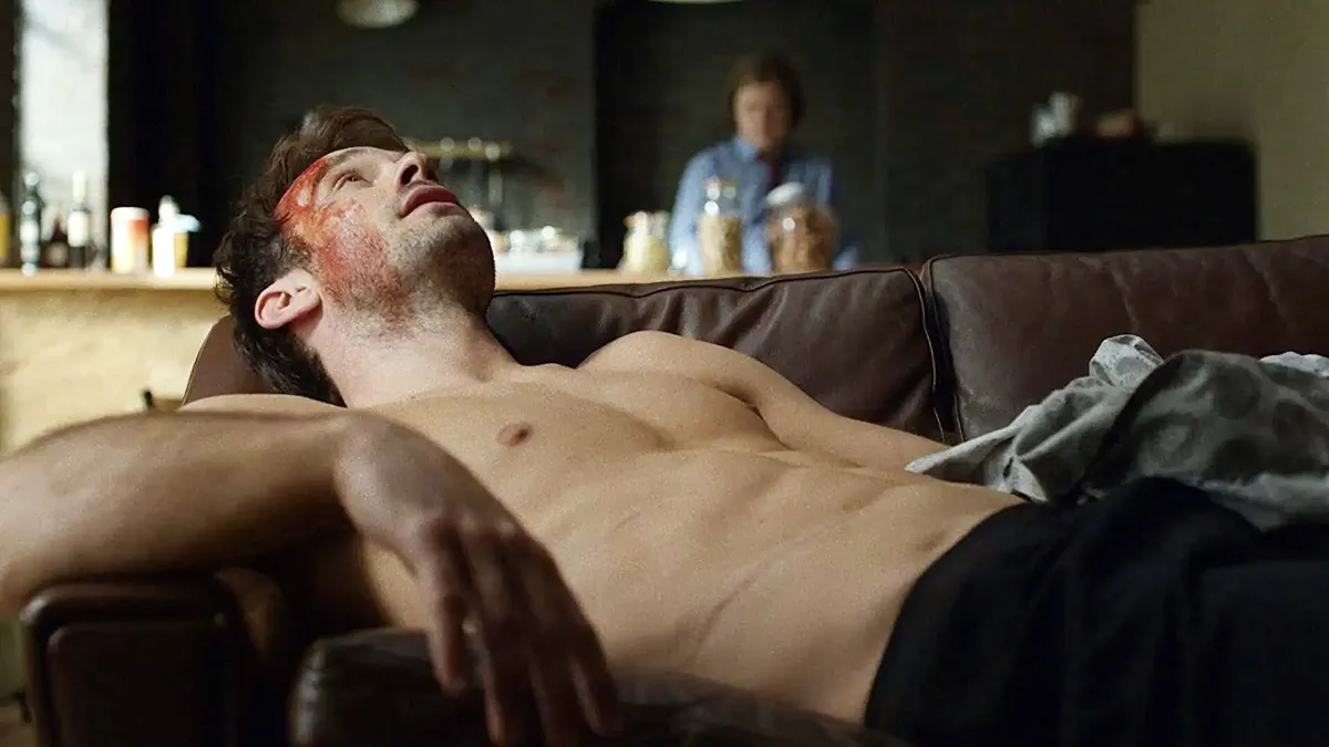 charlie cox laying on a couch hurt in daredevil shirtless