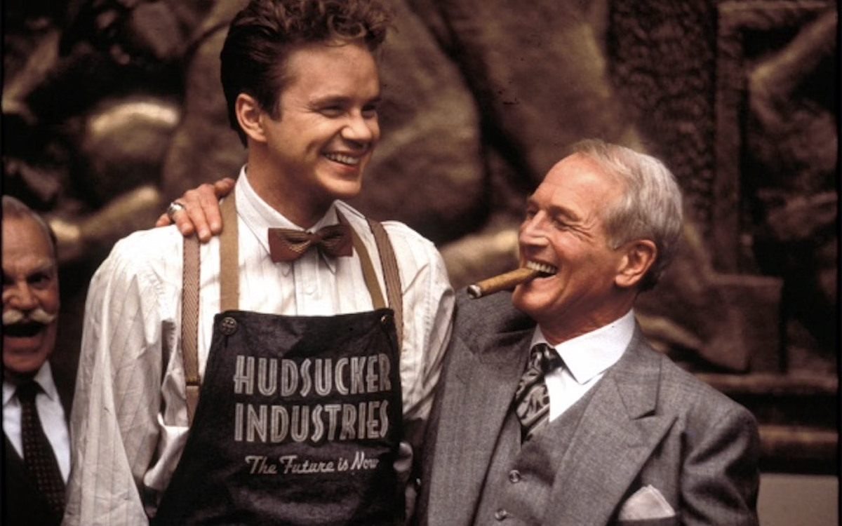 Tim Robbins and Paul Newman smiling and standing next to each other