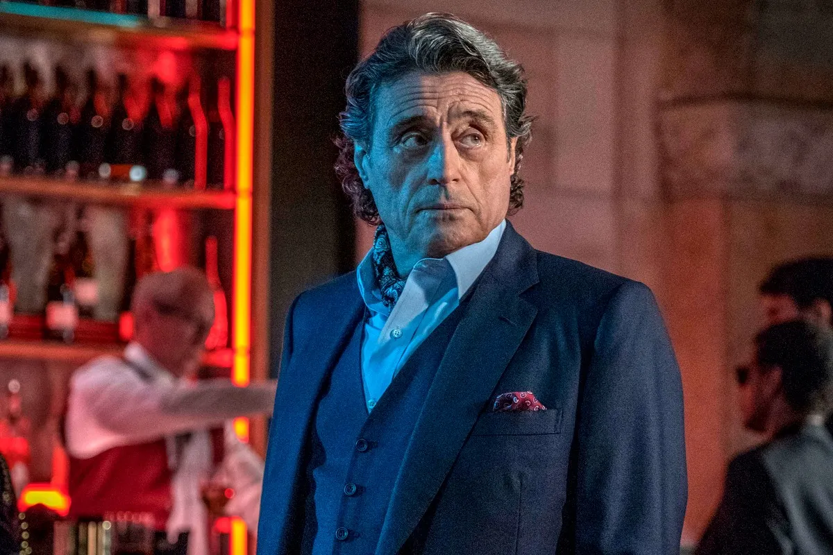 Ian McShane wears a well-tailored suit in this still from 'John Wick 4'.