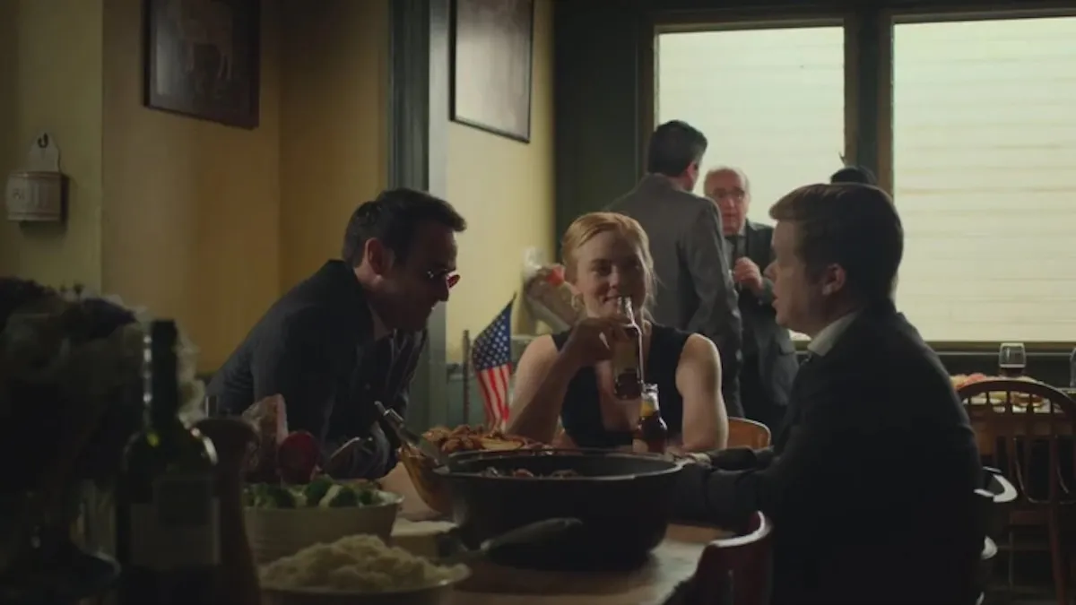 Karen, Matt, and Foggy all sitting at a table together drinking 