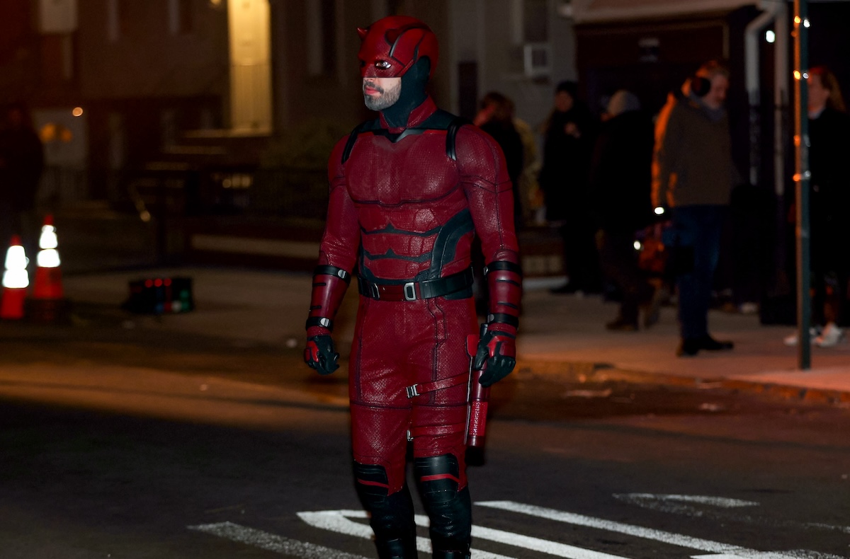 Charlie Cox on the streets of New york standing in his Daredevil costume