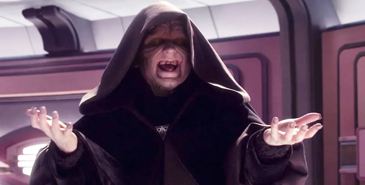 palpatine standing with his hood on, laughing with his arms in the air