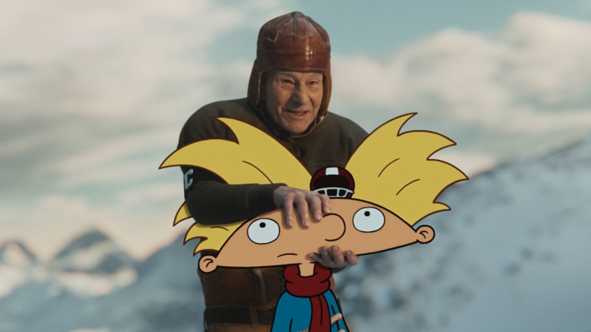 Patrick Stewart wears an old timey football uniform and prepares to toss 'Hey Arnold!' up the Paramount mountain in an ad for Paramount Plus.