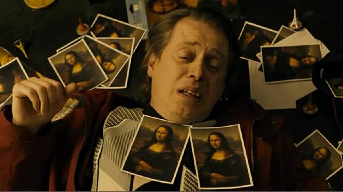 Steve Buscemi laying knocked out on the ground with pictures of the Mona Lisa surrouding him
