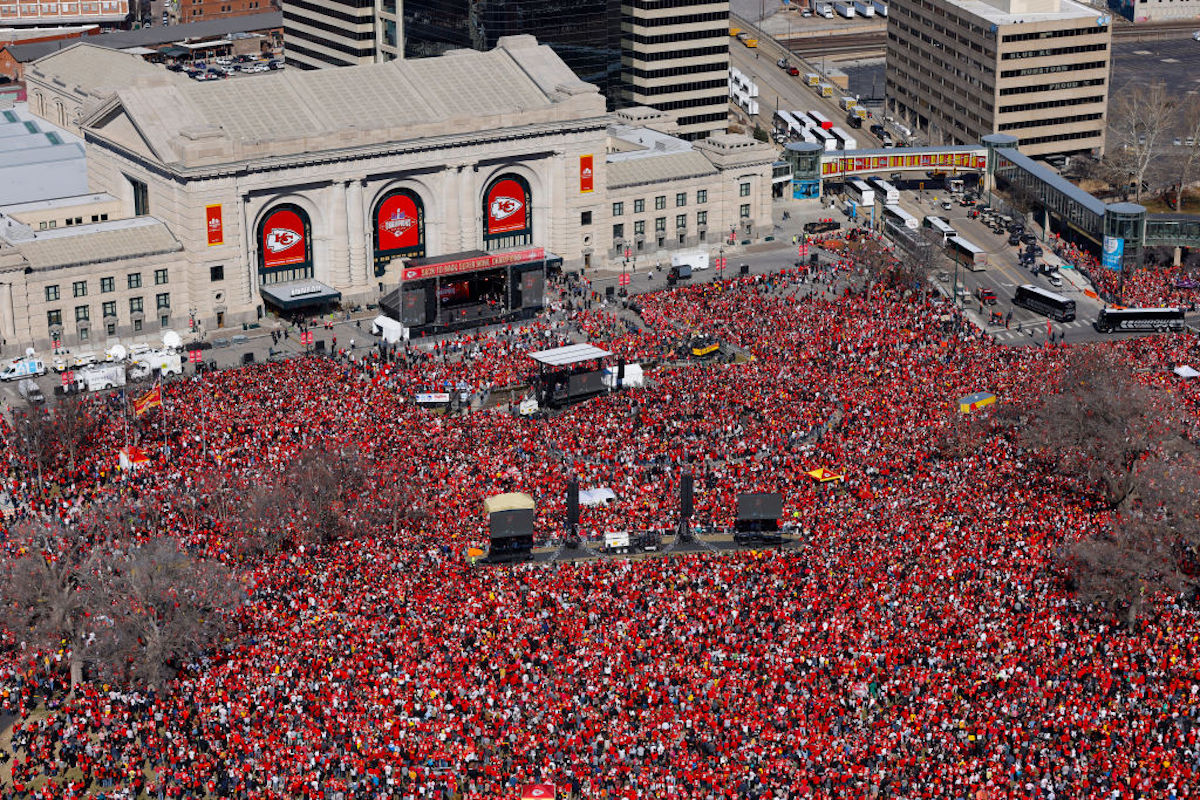 A massive crowd, all wearing red, gather at Kansas City's Union Station for the Chiefs SUper Bowl victory rally.