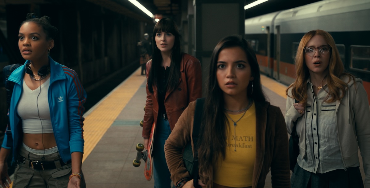 Mattie, Anya, Julia, and Cassie all standing in a line on a subway platform
