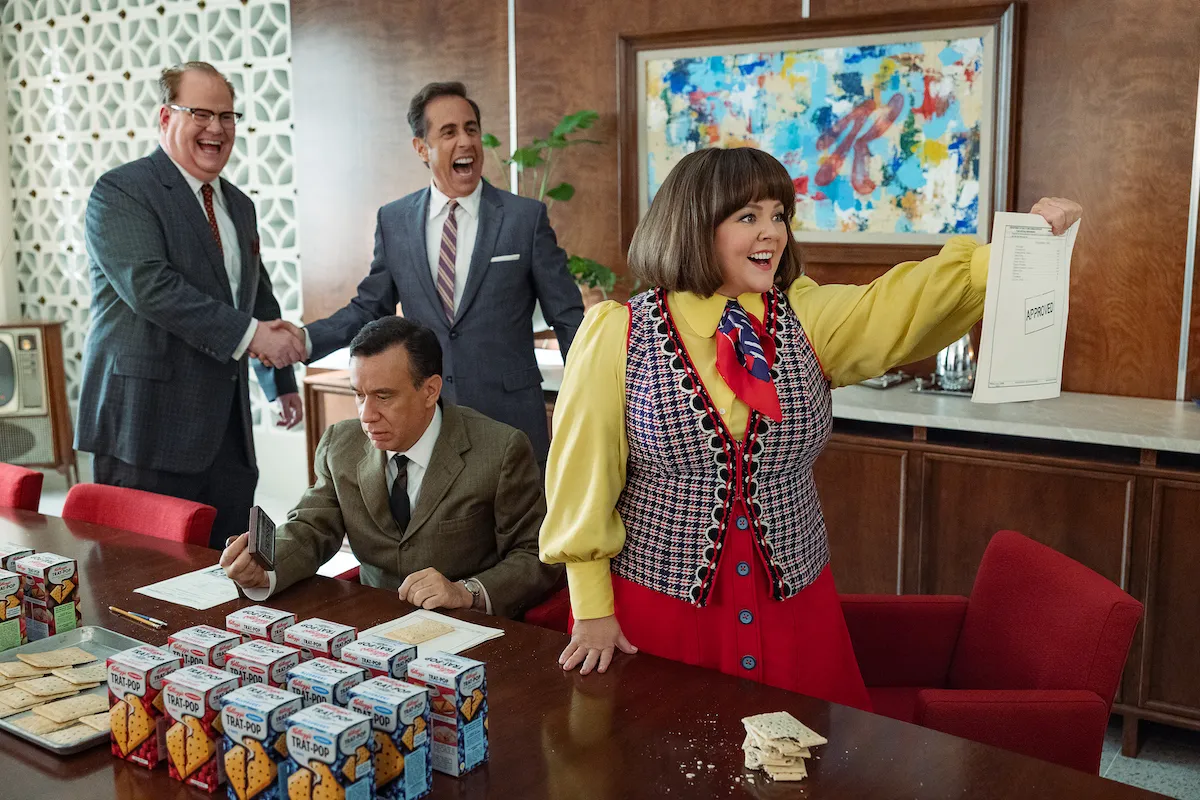 Jim Gaffigan, Jerry Seinfeld, Fred Armisen, and Melissa McCarthy dressed in period 1960s outfits in a scene from 'Unfrosted.'