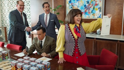 Jim Gaffigan, Jerry Seinfeld, Fred Armisen, and Melissa McCarthy dressed in period 1960s outfits in a scene from 'Unfrosted.'