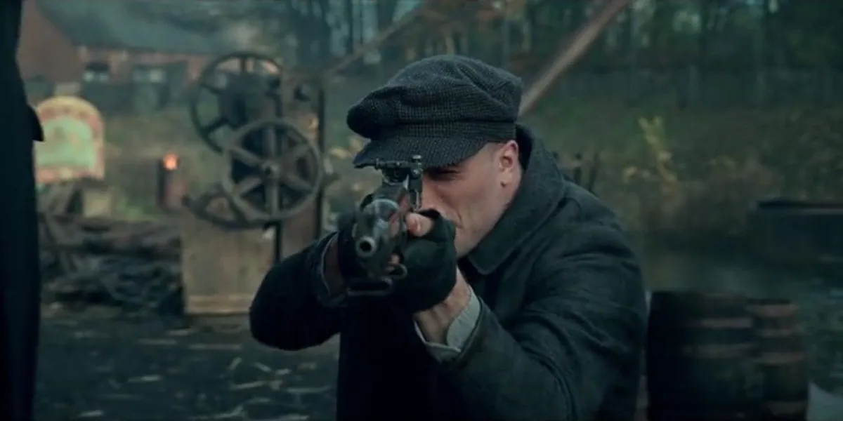 Barney Thompson aims a rifle in "Peaky Blinders"