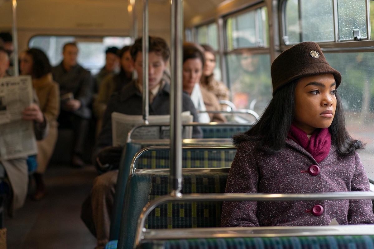 a young woman sits on a bus