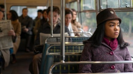 a young woman sits on a bus