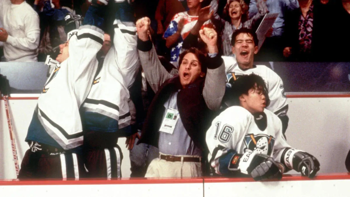 Coach Bombay (Emilio Estevez) and the Ducks cheering during the final game in D2: The Mighty Ducks