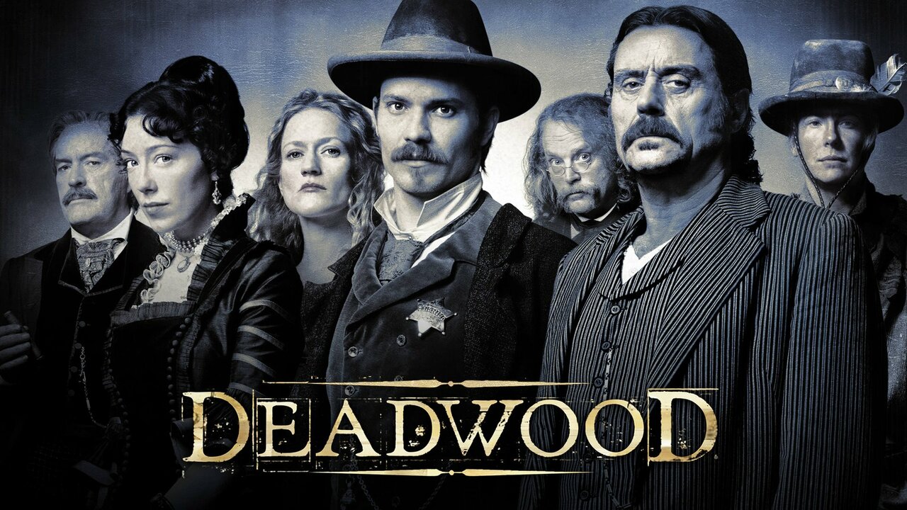 The cast of Deadwood behind the title word.