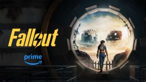Banner promotional image for the 'Fallout' show on Amazon Prime. The show logo is on the left, and on the right we see the character Lucy, a young woman with dark hair in a pony tail wearing a blue vault suit with a 33 on the back, walking out of a Fallout vault.