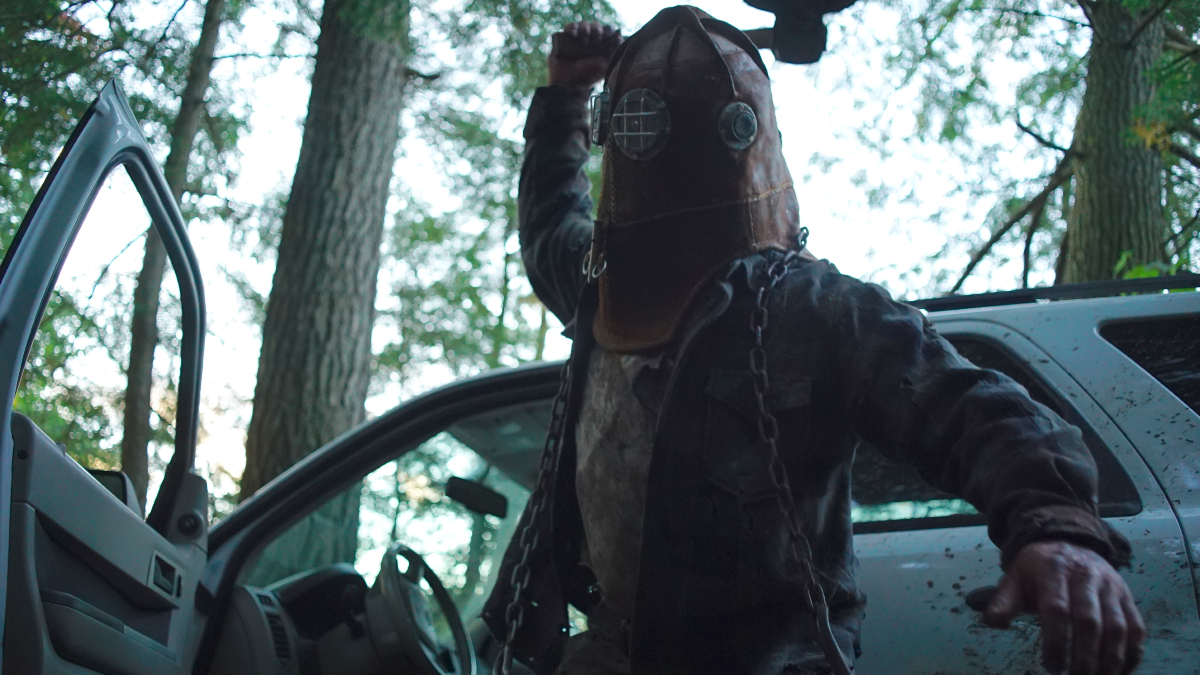 A masked killer prepares to bludgeon an unseen victim in 'In a Violent Nature'