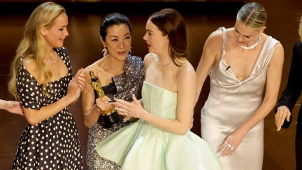 Jennifer Lawrence, Michelle Yeoh, and Emma Stone onstage during the presentation of Best Actress at the Oscars