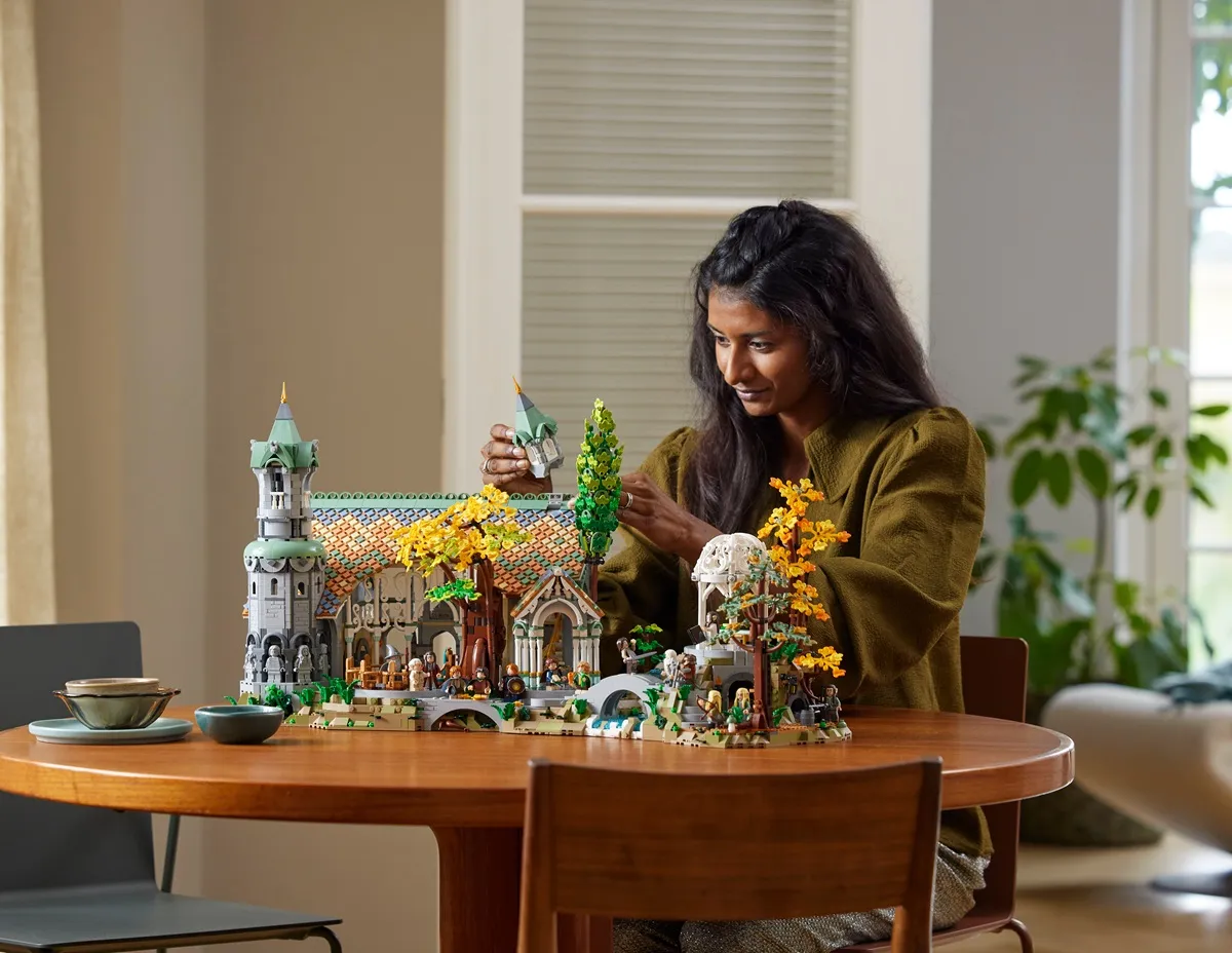 woman playing with the LEGO Lord of the Rings Rivendell