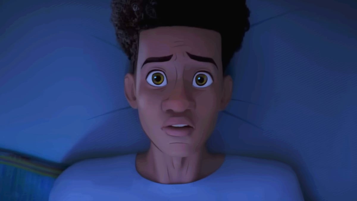 Miles Morals laying on his bed looking worried in The Spider Within: A Spider-Verse Story