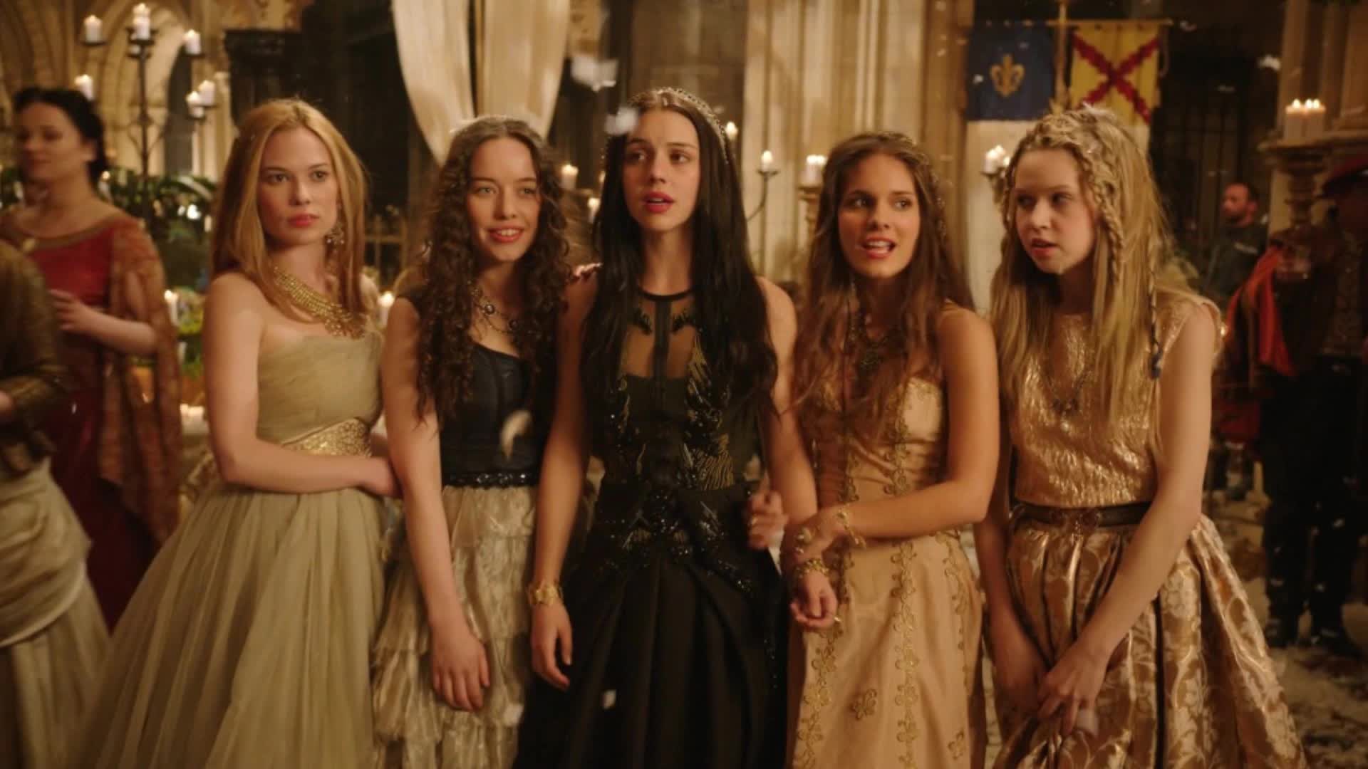 Five young woman in a medieval court all wear different expressions of emotion as they gather together.