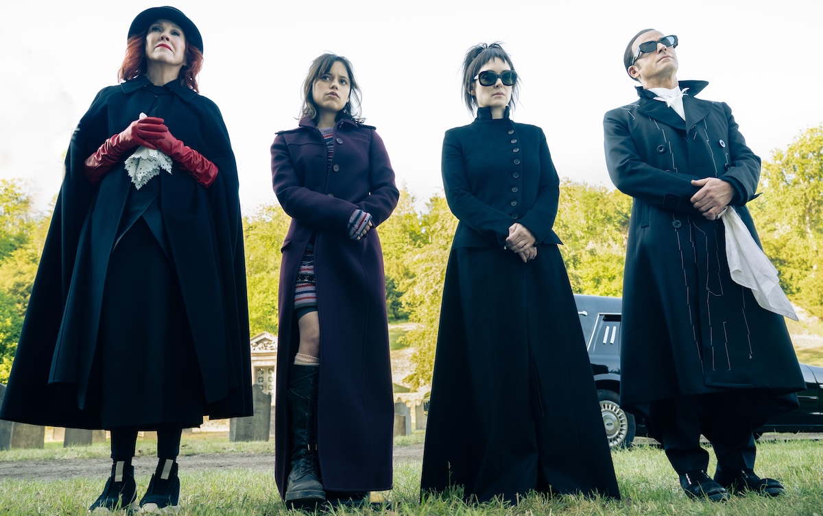 Delia, Astrid, Lydia, and Rory all standing in black in a line