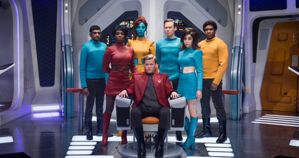 The cast of 'Black Mirror's episode 'U.S.S. Callister' stand in formation around captain Callister (Jesse Plemons).