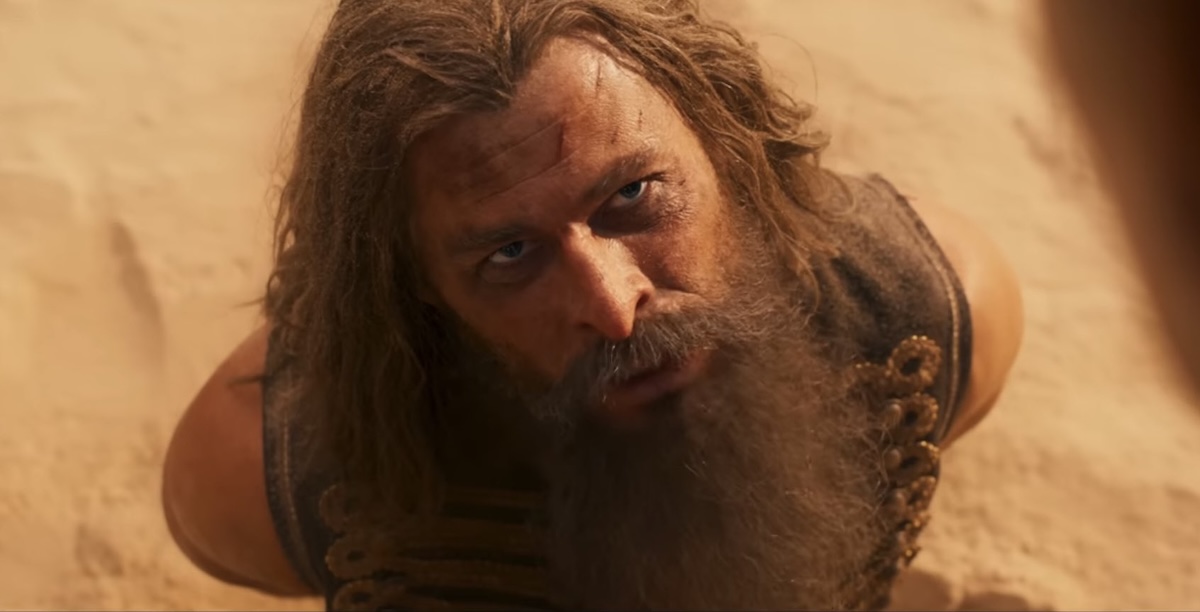 Chris Hemsworth as Warlord Dementus, looking up at the camera.