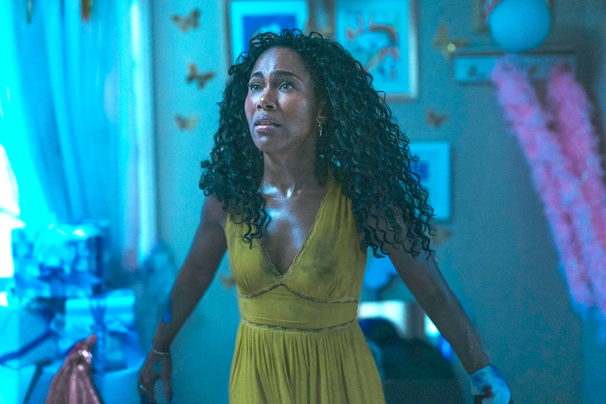 DeWanda Wise looking frightened in a yellow dress as Jessica in Imaginary