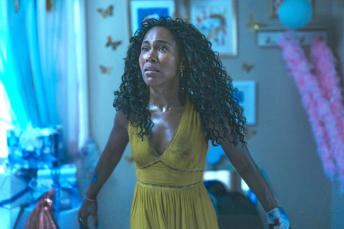 DeWanda Wise looking frightened in a yellow dress as Jessica in Imaginary