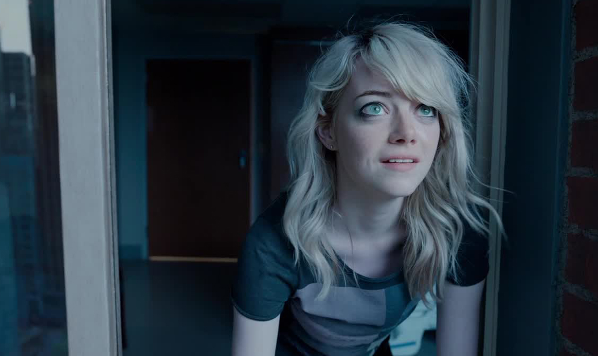 Emma Stone looking out of a window up at the sky