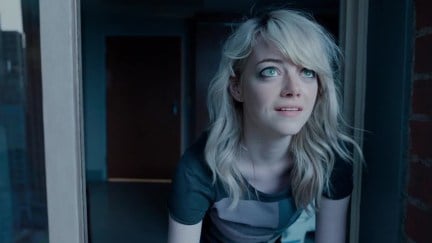 Emma Stone looking out of a window up at the sky